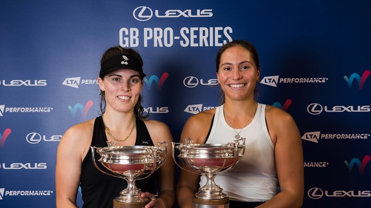 Maia Lumsden and Francisca Jorge holding their doubles trophies at the Lexus GB Pro Series event in Glasgow