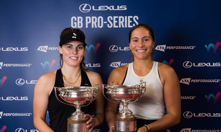 Maia Lumsden and Francisca Jorge holding their doubles trophies at the Lexus GB Pro Series event in Glasgow