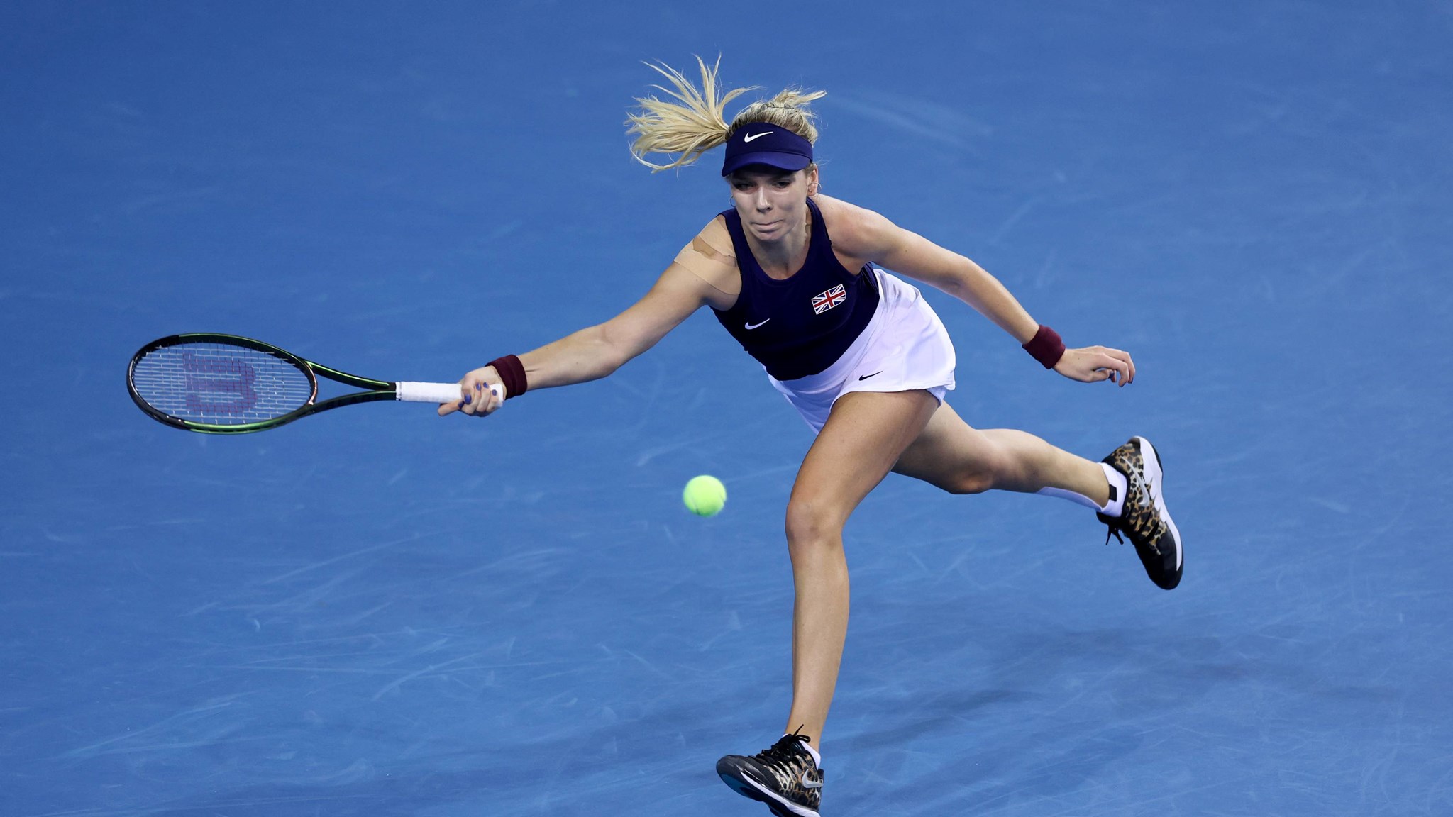 Katie Boulter plays a forehand against Kazakhstan's Yulia Putintseva at the 2022 Billie Jean King Cup at the Emirates Arena, Glasgow