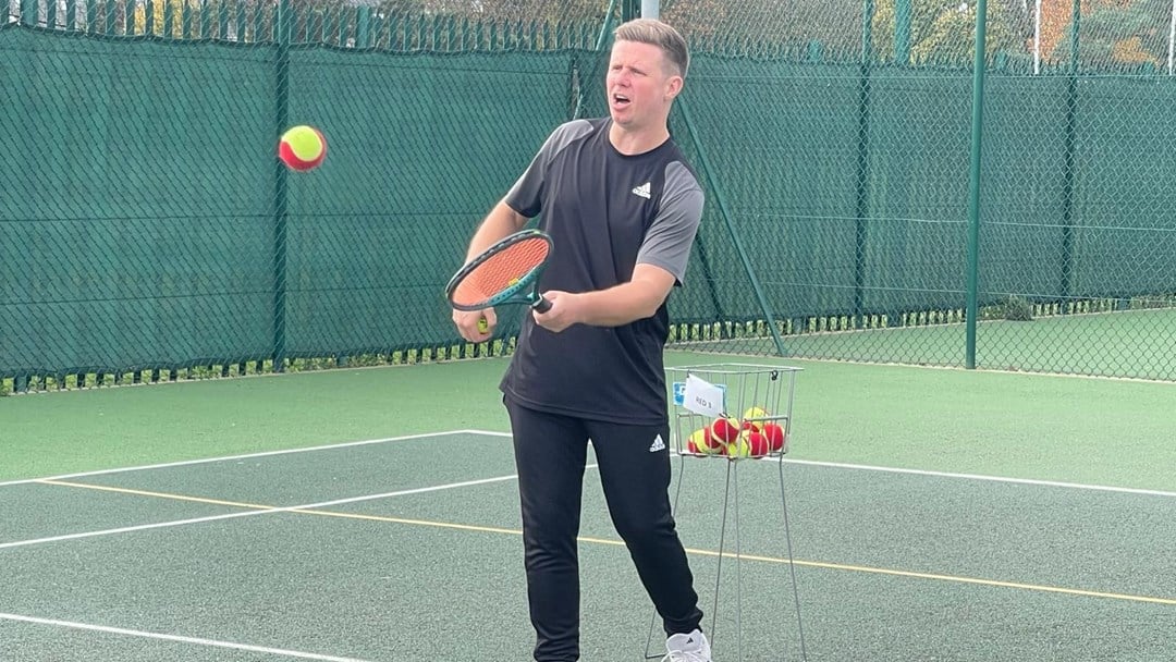 Tennis Coach James Ward leading a lesson