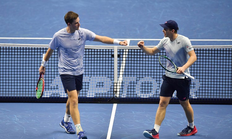 Henry Patten and Harri Heliovaara fist bump in their first match at the Nitto ATP Finals