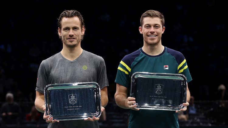 Neal Skupski and Wesley Koolhof holding the Rolex Paris Masters doubles trophy