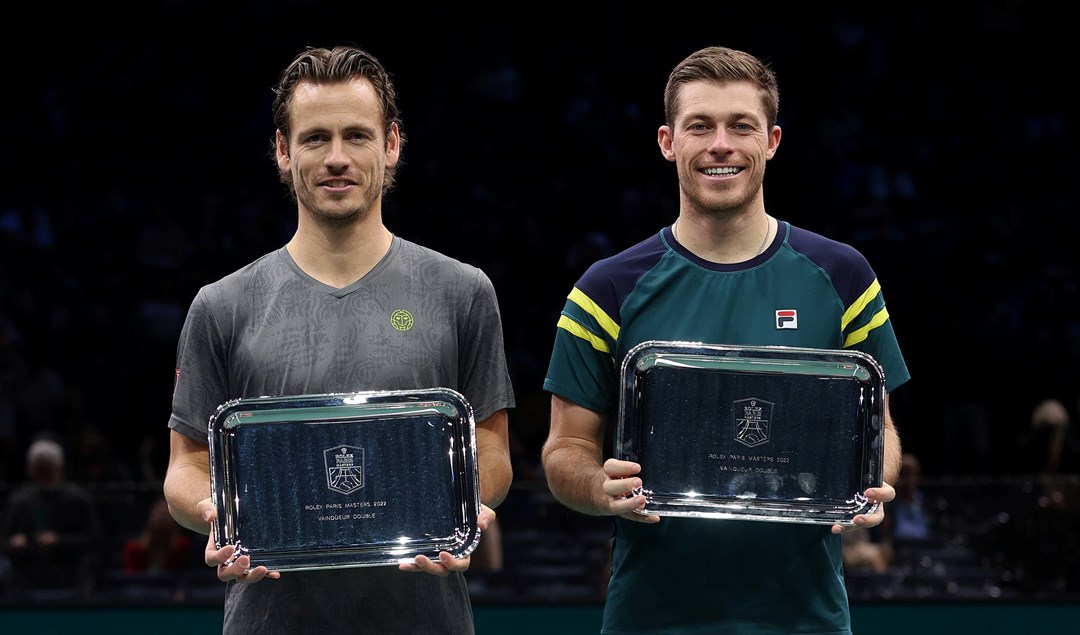 Neal Skupski and Wesley Koolhof holding the Rolex Paris Masters doubles trophy