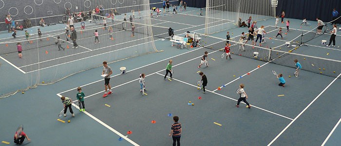 Kids tennis coaching session
