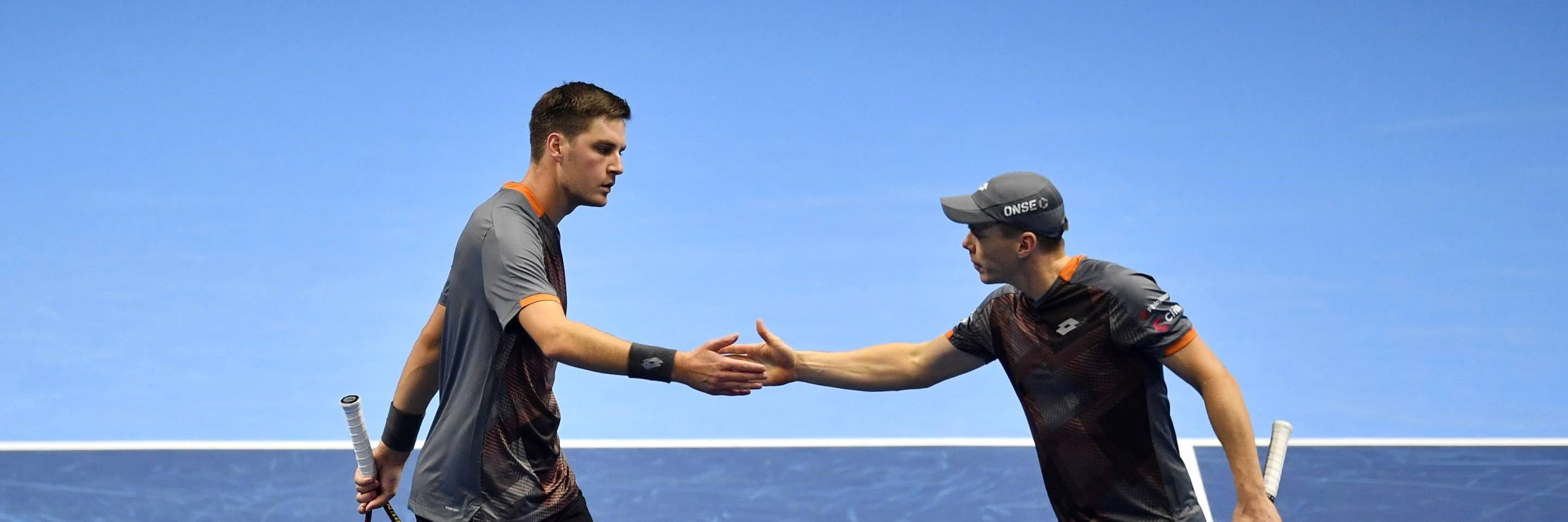Henry Patten and Harri Heliovaara high five during the Nitto ATP Finals