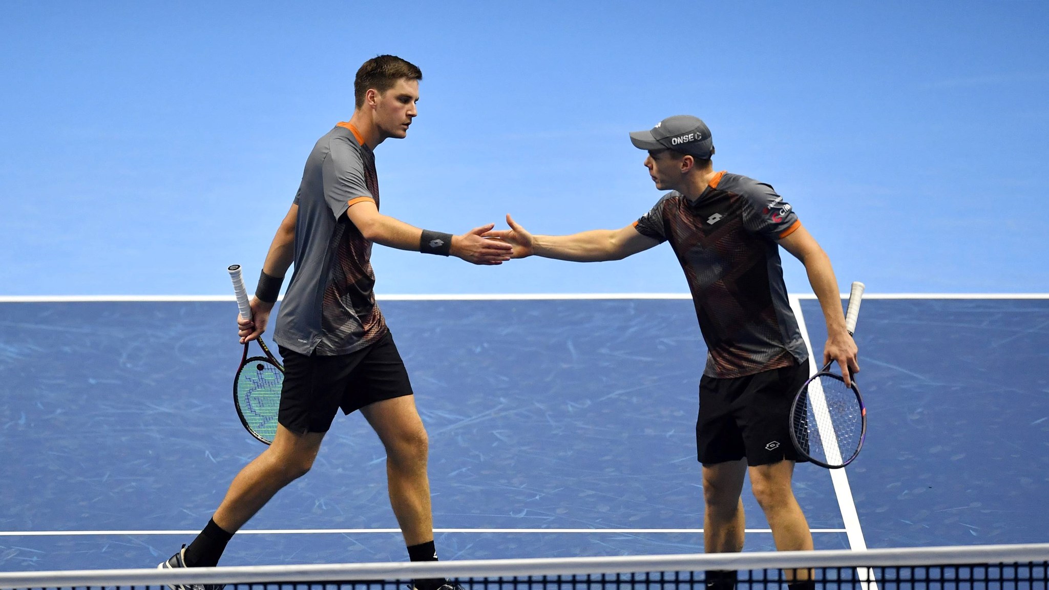 Henry Patten and Harri Heliovaara high five during the Nitto ATP Finals