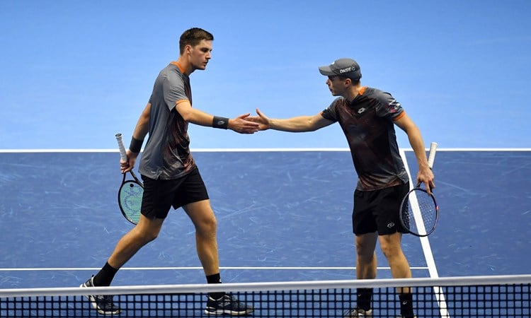 Henry Patten and Harri Heliovaara high five during the Nitto ATP Finals