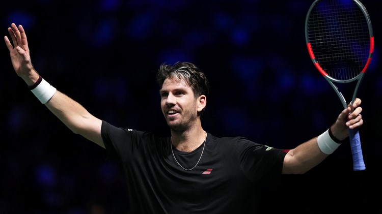 Cam Norrie celebrates defeating Carlos Alcaraz at the Rolex Paris Masters