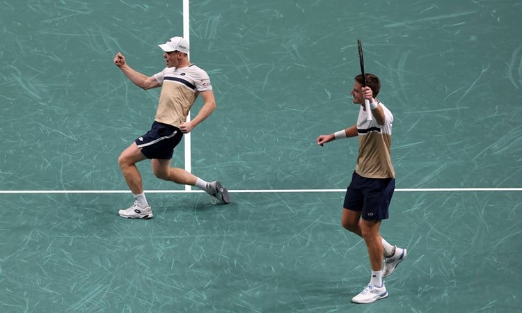 Harri Heliovaara and Henry Patten celebrate winning the Rolex Paris Masters title