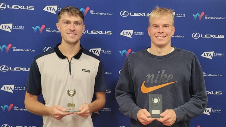 James Story holding the Lexus British Pro Series title next to runner-up Anton Matusevich