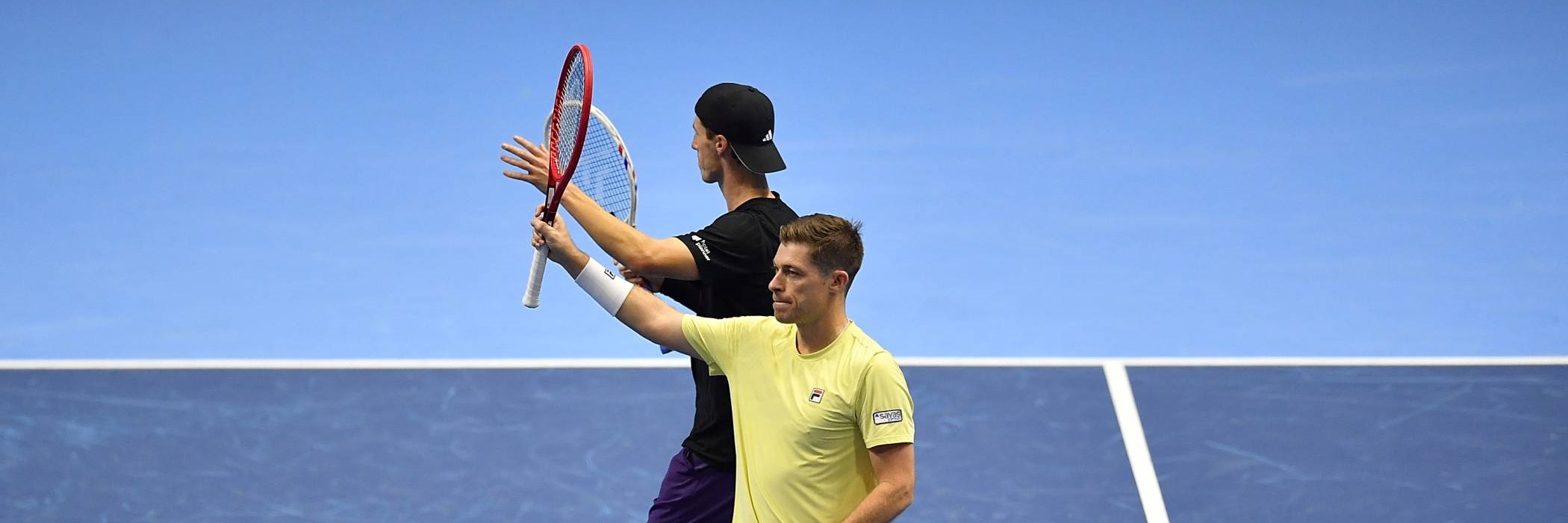 British doubles stars Neal Skupski and Joe Salisbury stood on court at the Nitto ATP Finals