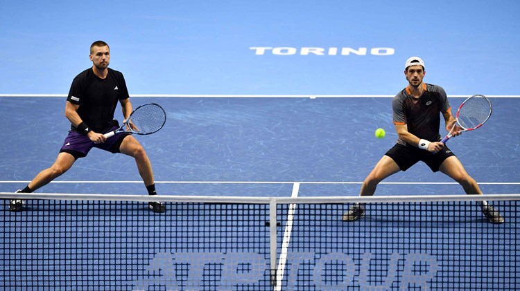 Lloyd Glasspool and Julian Cash stood at the net at the Nitto ATP Finals, preparing to hit a volley