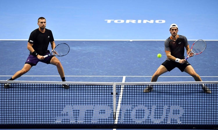 Lloyd Glasspool and Julian Cash stood at the net at the Nitto ATP Finals, preparing to hit a volley
