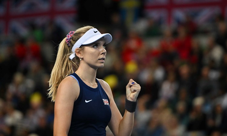Katie Boulter clenches her fist in celebration on court at the Billie Jean King Cup