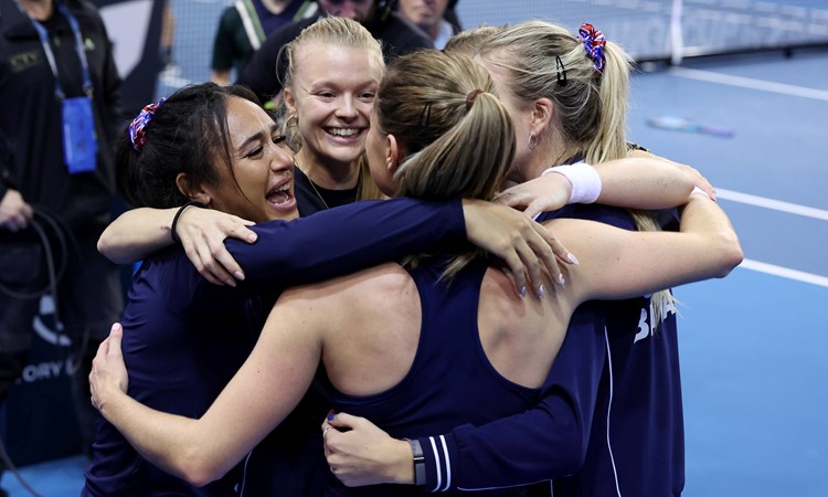 The Bille Jean King Cup squad hug after defeating Spain to reach the semi-finals