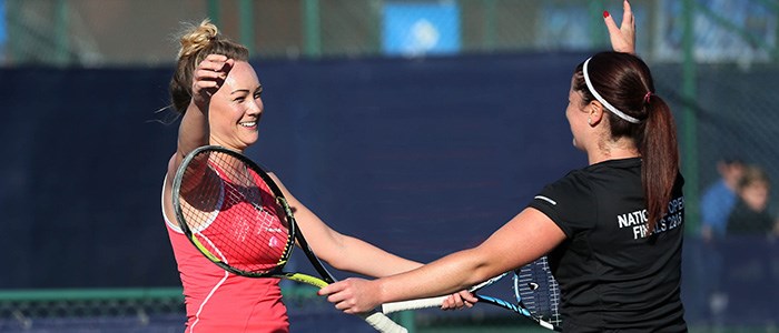 Two tennis players celebrating at the Aegon team tennis national open finals