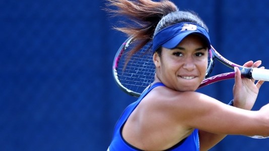 close up of heather watson on court swinging racket back to play a backhand