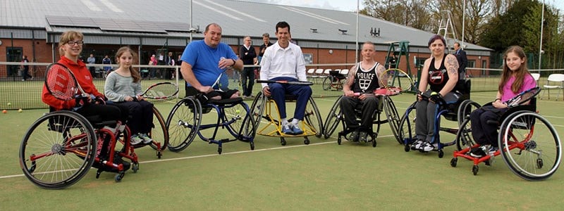 Group of wheelchair tennis players on a tennis court