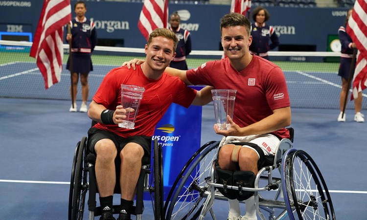Hewett and Reid smiling holding their trophies