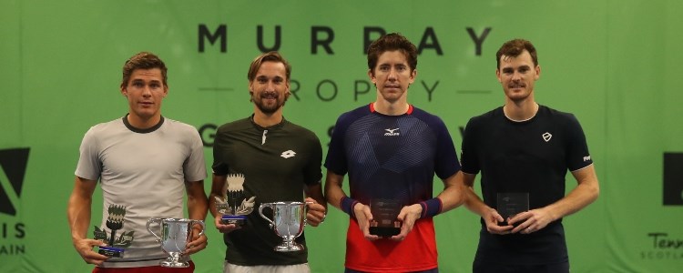 jamie murray and three other players holding trophies in hand in front of murray trophy sign