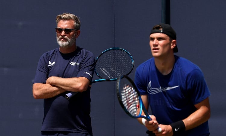 Coach James Trotman at practice with Jack Draper