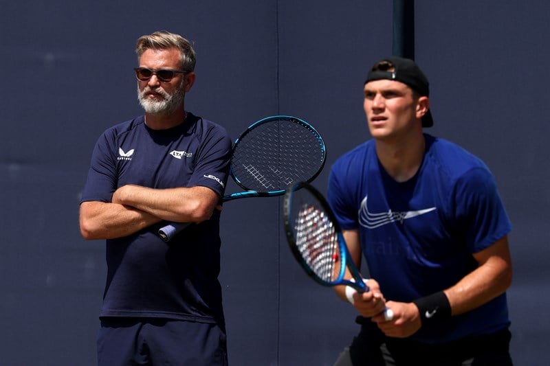 Coach James Trotman at practice with Jack Draper