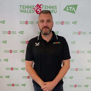 Simon posing for a picture at tennis wales