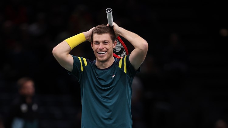 Neal Skupski celebrates winning the Paris Masters trophy