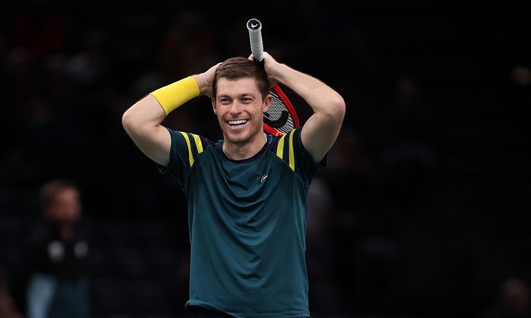 Neal Skupski celebrates winning the Paris Masters trophy