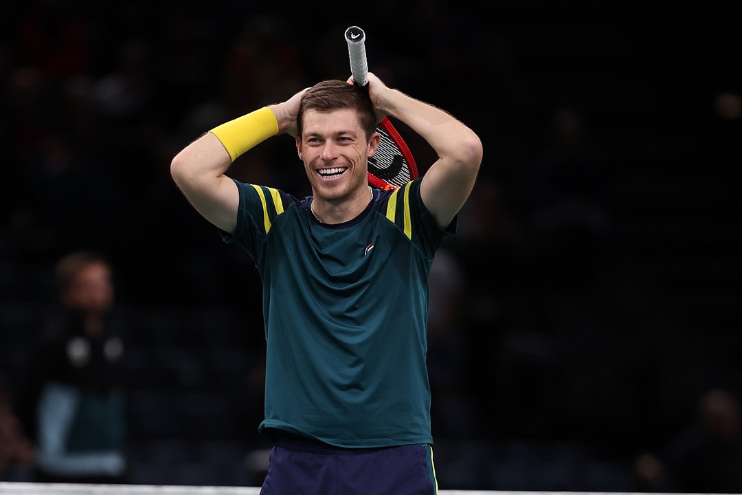 Neal Skupski celebrates winning the Paris Masters trophy