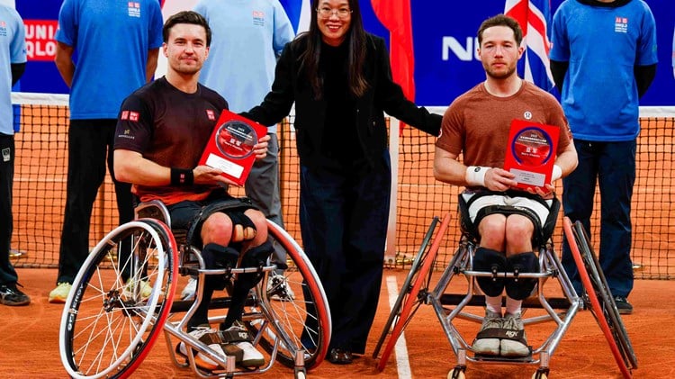 Gordon Reid and Alfie Hewett holding their runners-up trophies at the Doubles Masters final