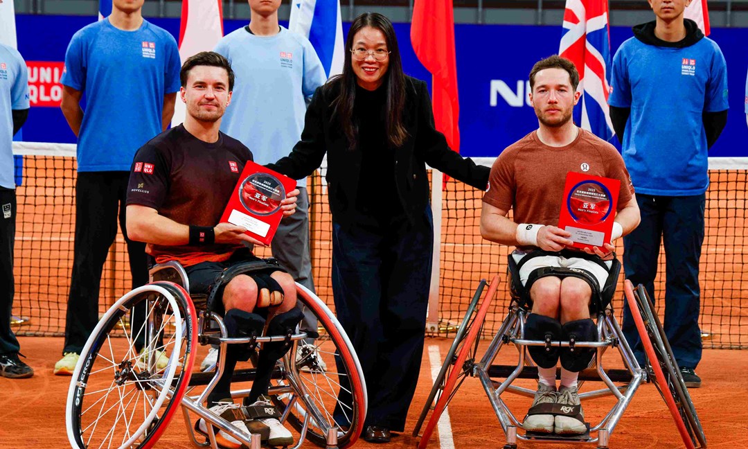 Gordon Reid and Alfie Hewett holding their runners-up trophies at the Doubles Masters final