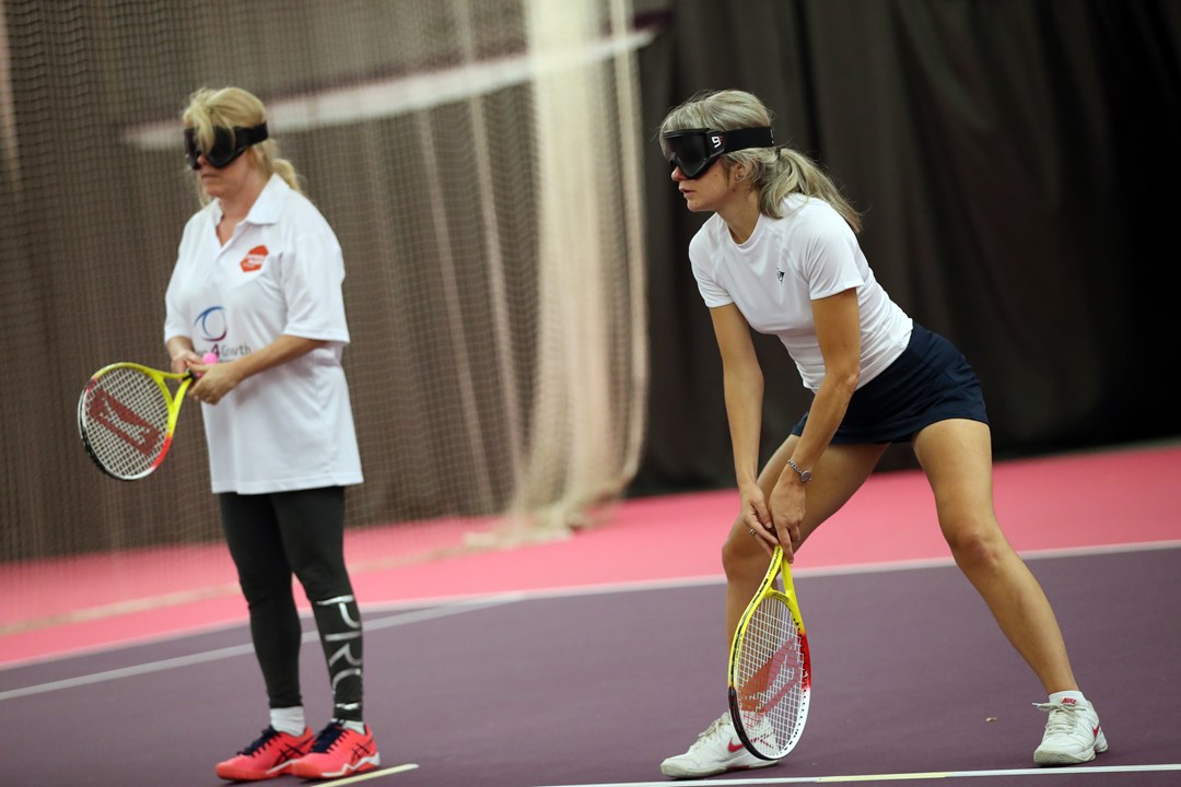Visually impaired tennis players in action