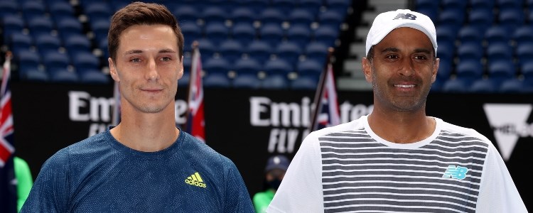 Joe Salisbury and Rajeev Ram smiling on a tennis court