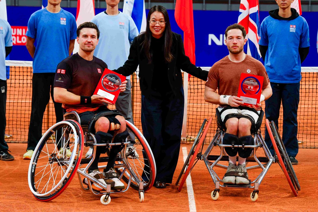 Gordon Reid and Alfie Hewett holding their runners-up trophies at the Doubles Masters final