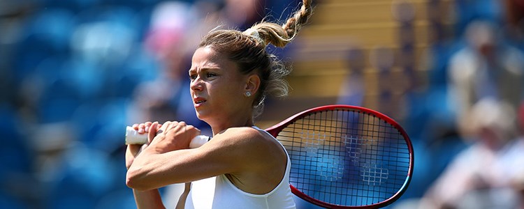 Camila Giorgi after playing a forehand shot in tennis