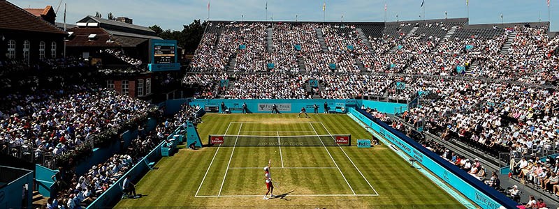 birds eye view of grass courts at fever tree with woman's singles match  being played