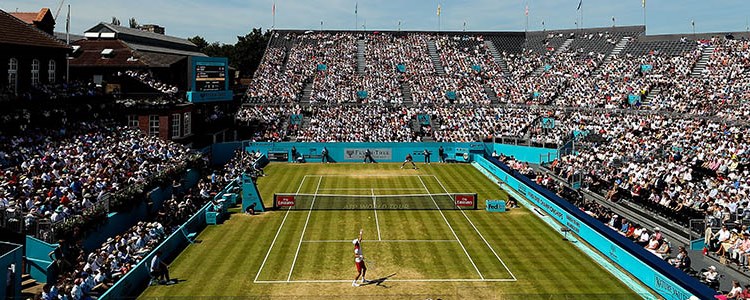 birds eye view of grass courts at fever tree with woman's singles match  being played