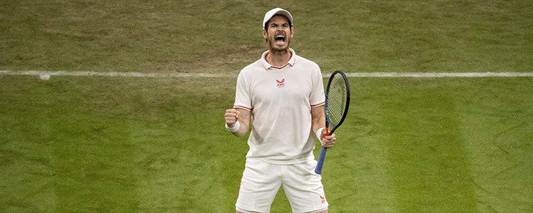 Andy Murray celebrating on a tennis court with his tennis gear