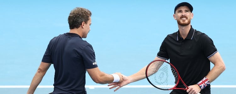 Bruno Soares and Jamie Murray handshake on tennis court