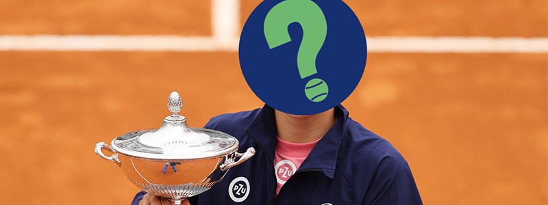 Person holding a trophy on a tennis court with a question mark symbol on their face