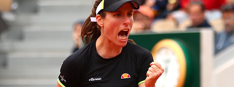 Johanna Konta passionately celebrating in front of an audience in a tennis court
