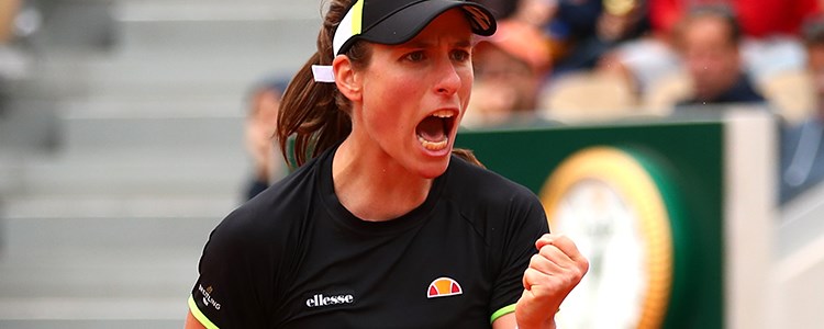 Johanna Konta passionately celebrating in front of an audience in a tennis court