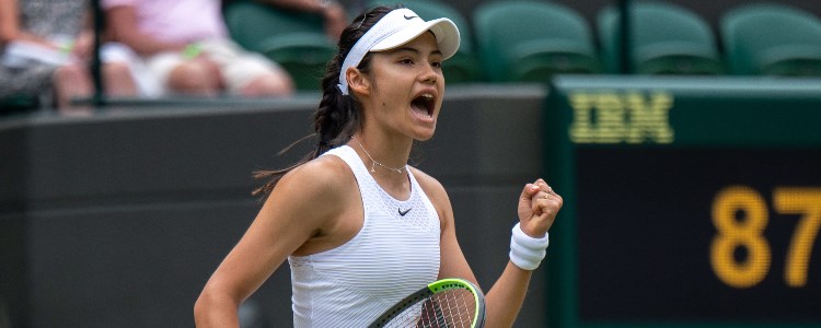 Emma Raducanu celebrating on a tennis court