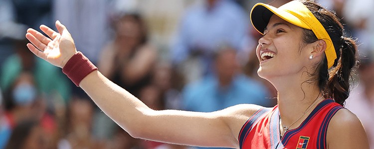 close up of emma raducanu smiling and waving hand out