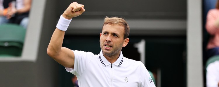 Dan Evans celebrating on a tennis court