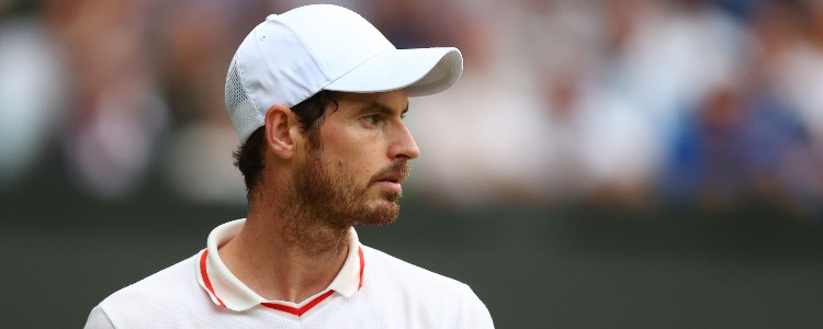 Andy Murray looking to his left in front of a blurred out crowd