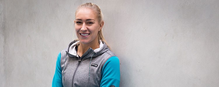 header image of jocely rae smiling wearing blue and grey sweater