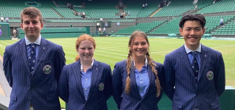 four new officials for the 134th championship standing in front of a Wimbledon tennis court