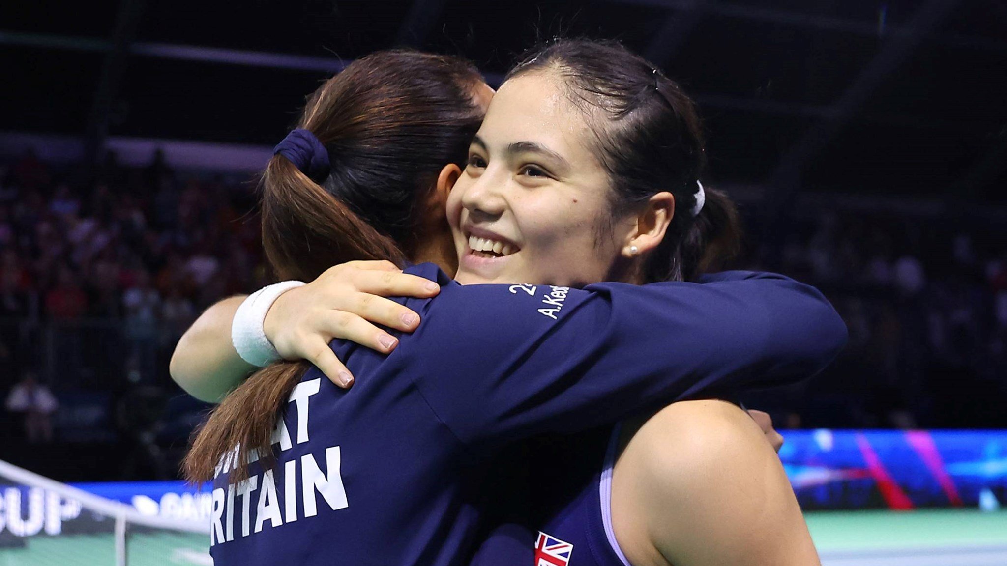Emma Raducanu and Anne Keothavong hug after Great Britain beat Canada at the Billie Jean King Cup